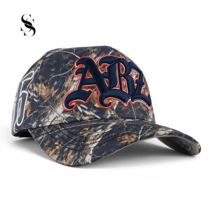 Ropa de camuflaje AB’z CAMO de la marca Second Shot, con patrón de camuflaje en tonos verdes y marrones.