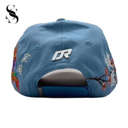 Sombrero El Dreamer Hats Kanji 2.0 de Second Shot con diseño de caracteres kanji y estilo contemporáneo, visible en la imagen.