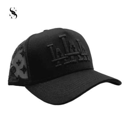 Gorra Rude Awakings LALALA en negro completo, marca Second Shot, con detalles en negro y diseño llamativo y moderno.