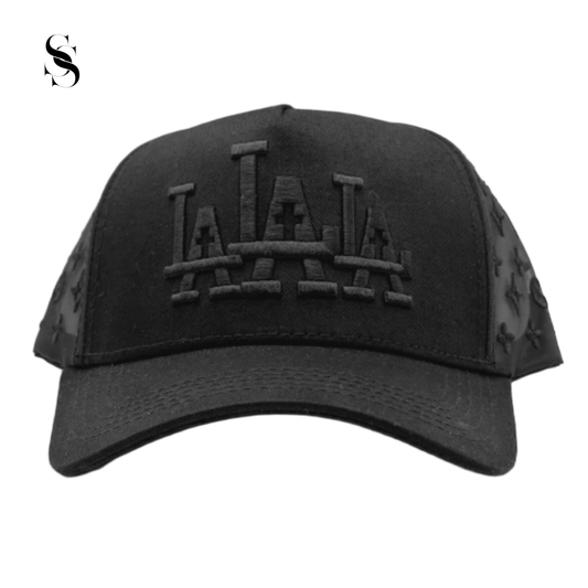 Gorra Rude Awakings LALALA en negro completo, marca Second Shot, con detalles en negro y diseño llamativo y moderno.