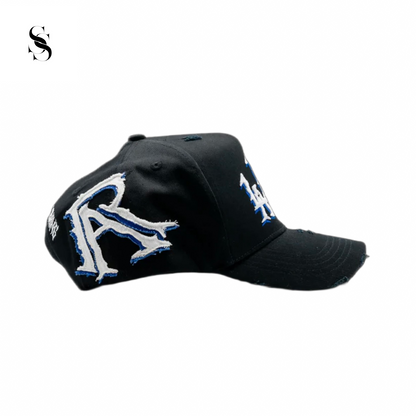 Gorra Rude Awakenings LALALA con espinas de la marca Second Shot, en plata y diseño llamativo.